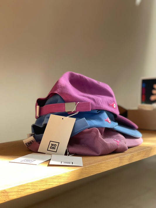 Cap Classic "Fish" Slightly curved brim Fish embroidery on the side Label on the back Buckle to adjust the fit 3 Colors available : Light Blue Grape Purple ( darker color than the sweet potato purple ) Sweet Potato Purple ( lighter color than the grape purple ) 100 % cotton One size