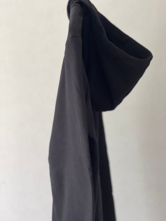 Super cozy hoodie with a kangaroo pocket in the front with no drawstrings. Crafted from 100 % superfine cotton. Raglan sleeves, ribbed trims. The pieces have a pink fish print on front left bottom corner and 4 black fishes print on right chest side. Colour: black Material: 100% cotton