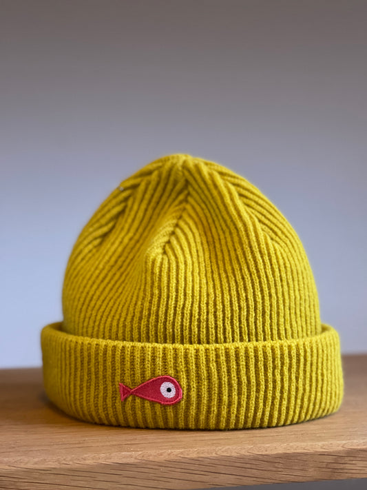 The collection of soft, colorful, and warm beanies crafted from luxurious lambswool yarn. Embrace comfort and style with these lovely accessories available in three charming colors: yellow, grey and brown