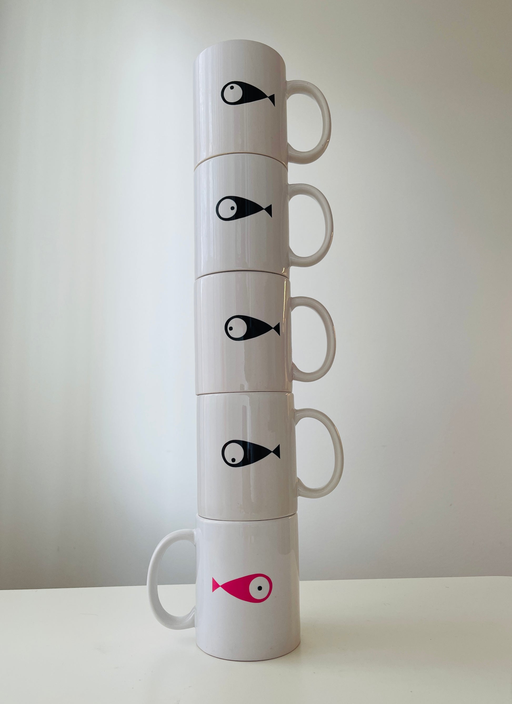 WOODI 5 Fishes Mugs  Set of 5  Porcelain&nbsp;mug&nbsp;features large handle  Illustration on every mug with each&nbsp;fish looking at a different direction  Perfect for enjoying a cup of coffee or tea  Dimensions (height): 9 cm  Diameter: 8 cm  Dishwasher safe but hand washing suggested