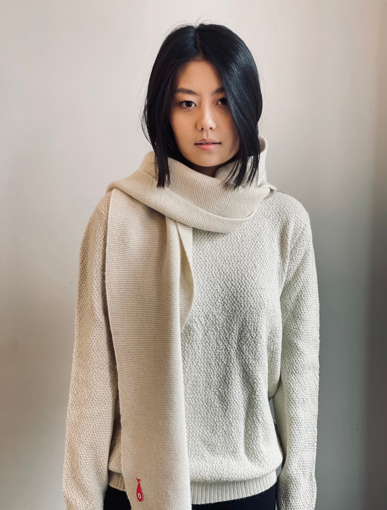 Soft, luxuriously and cozy scarfs. Knitted from a superfine alpaca yarn. Classic scarfs with a lovely feeling.  Colours : creme white, navy blue and grey  Material: 100% alpaca  Patch: pink fish  Sizes:  Navy Blue color : 2.20 cm x 22 cm  Grey color : 2.20 cm x 22 cm   Creme White color :  200 cm x 22 cm Front Smart casual dress code