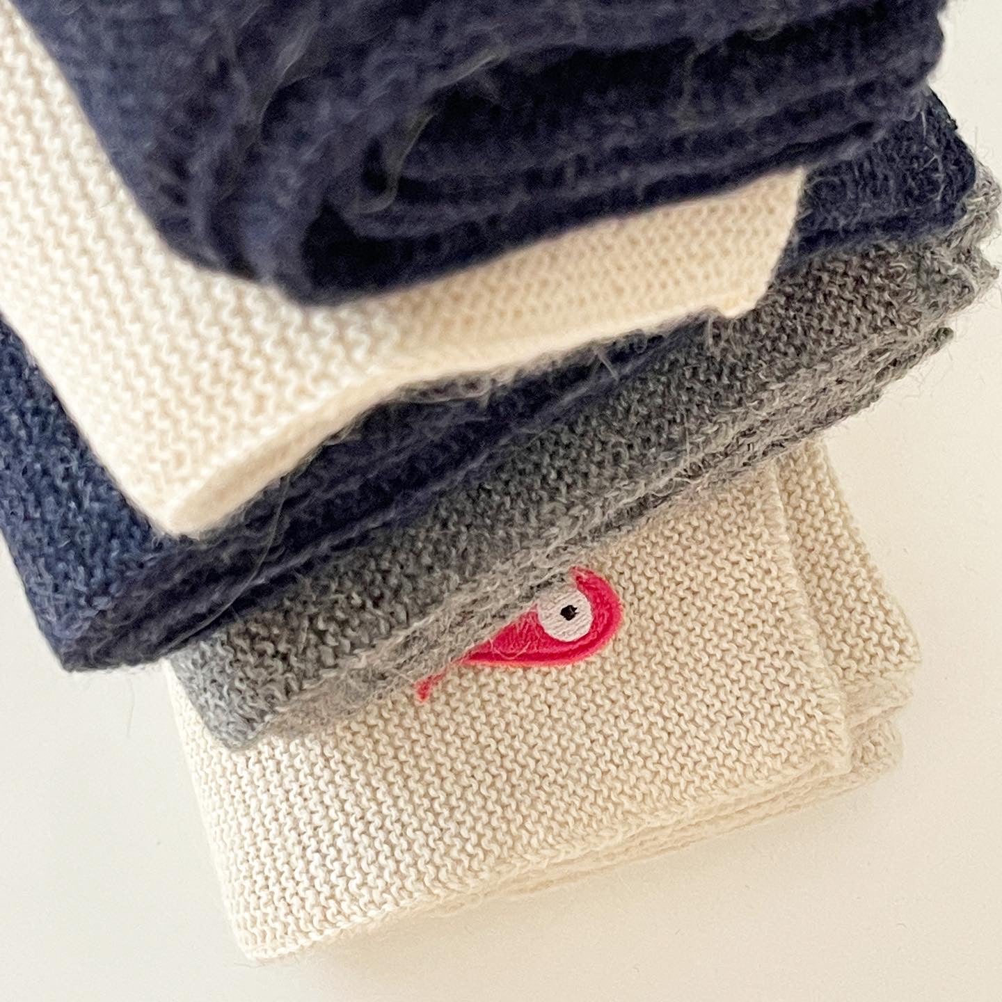 Soft, luxuriously and cozy scarfs. Knitted from a superfine alpaca yarn. Classic scarfs with a lovely feeling.  Colours : creme white, navy blue and grey  Material: 100% alpaca  Patch: pink fish  Sizes:  Navy Blue color : 2.20 cm x 22 cm  Grey color : 2.20 cm x 22 cm   Creme White color :  200 cm x 22 cm Detail  Smart casual dress code