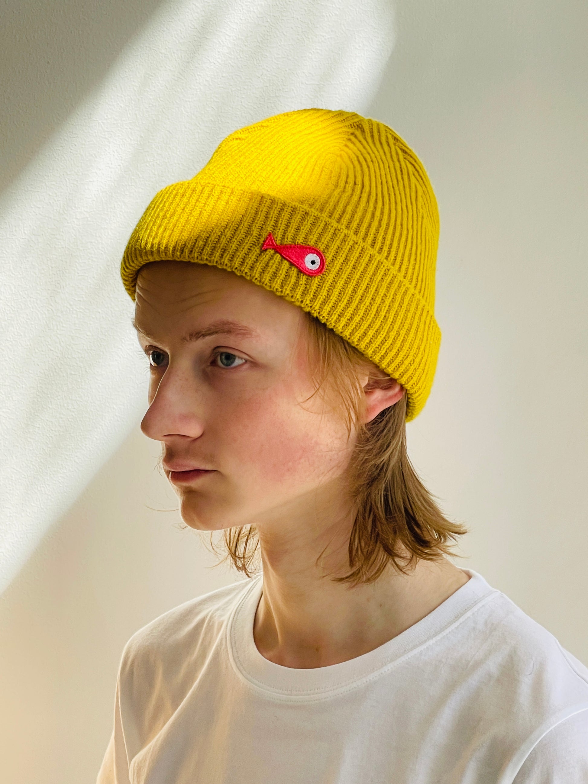 The collection of soft, colorful, and warm beanies crafted from luxurious lambswool yarn. Embrace comfort and style with these lovely accessories available in three charming colors: yellow, grey and brown