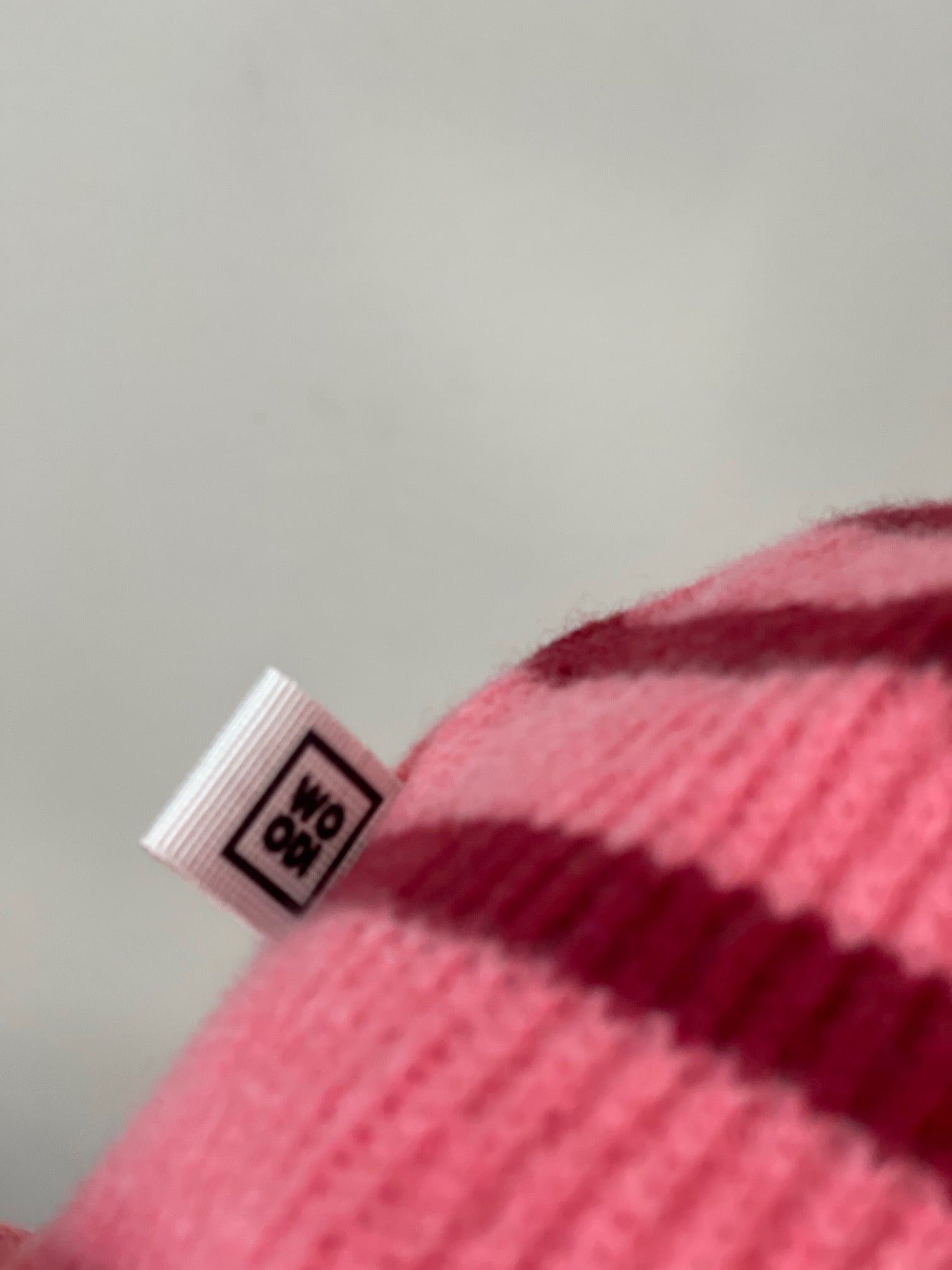 The collection of soft, colorful, and warm beanies crafted from luxurious lambswool yarn. Embrace comfort and style with these lovely accessories available in two lovely colors: Pink with red stripes and Navy blue with lighter blue stripes. Detail