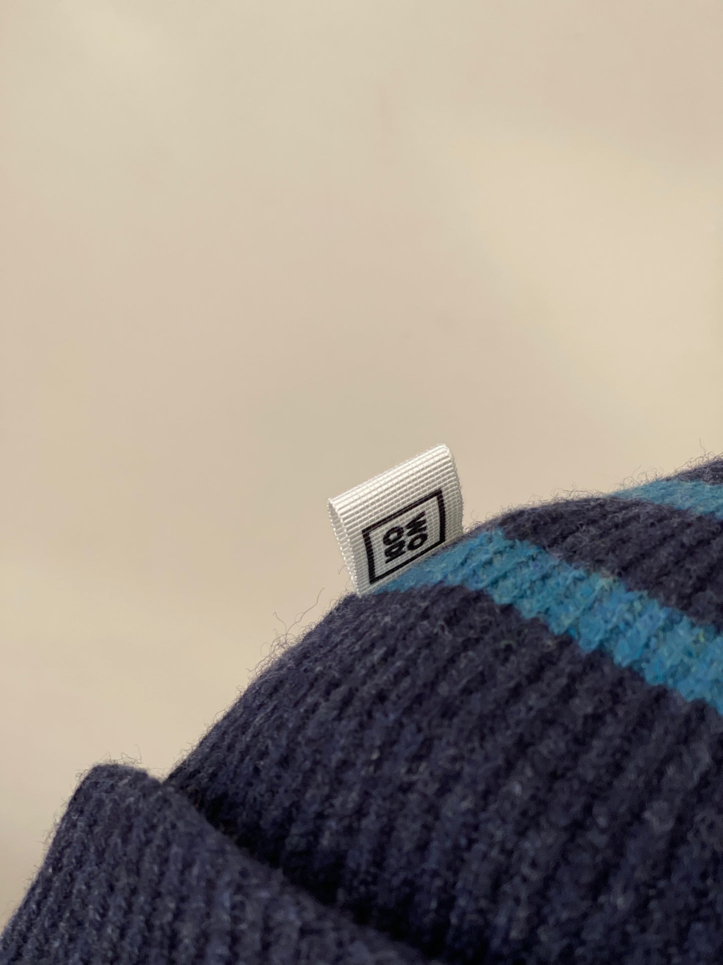 The collection of soft, colorful, and warm beanies crafted from luxurious lambswool yarn. Embrace comfort and style with these lovely accessories available in two lovely colors: Pink with red stripes and Navy blue with lighter blue stripes. Detail