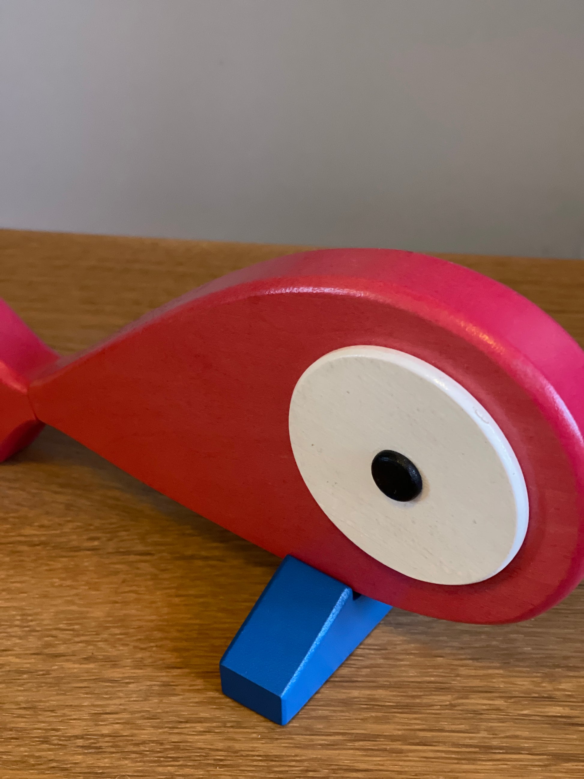 A lovely hand carved and hand painted art toy with a removable magnet tail. Blue stand that represents the ocean and when the fish is placed on the stand it feels like the fish is placed on the top of the water. Detail