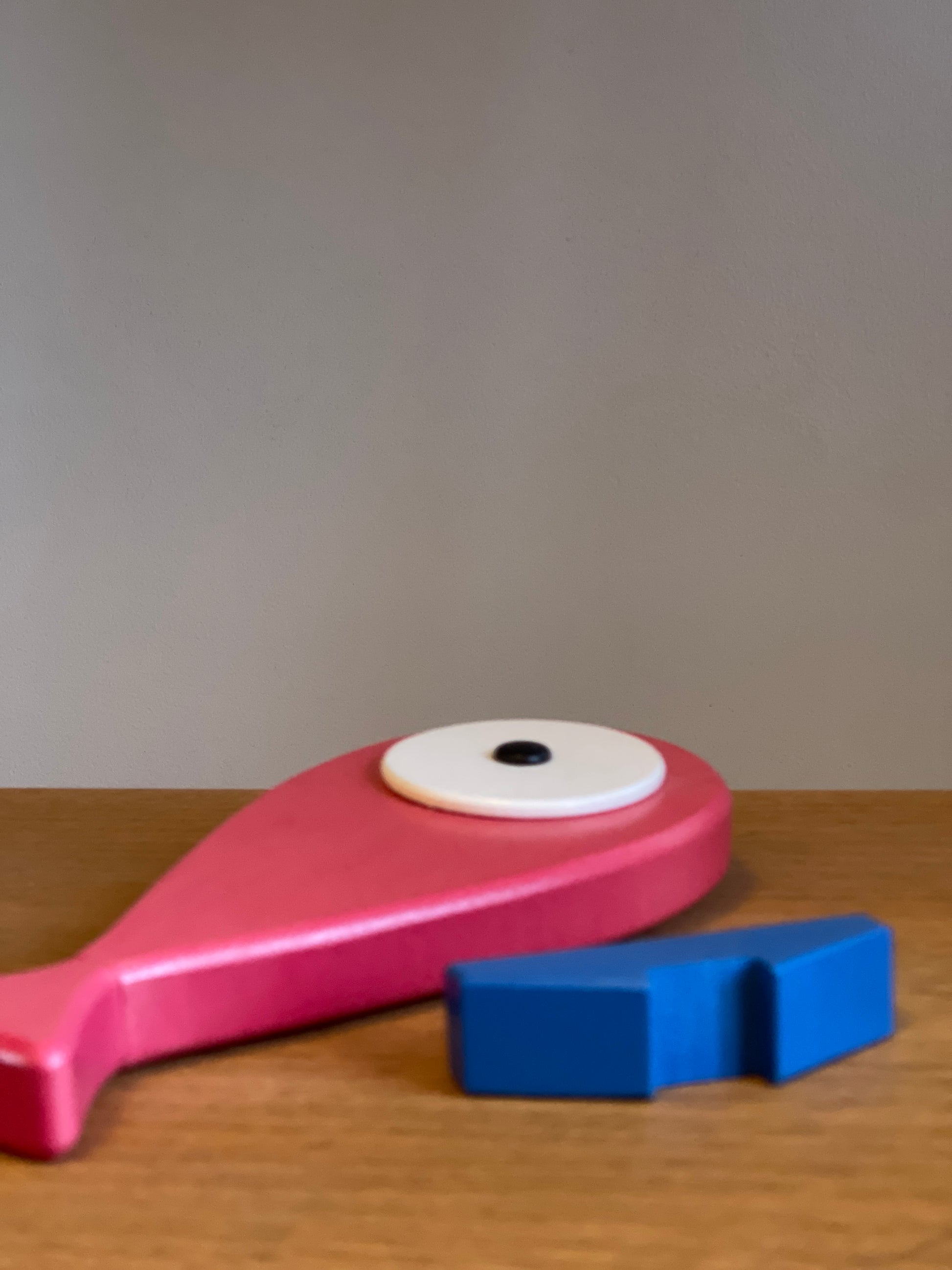 A lovely hand carved and hand painted art toy with a removable magnet tail. Blue stand that represents the ocean and when the fish is placed on the stand it feels like the fish is placed on the top of the water. Detail