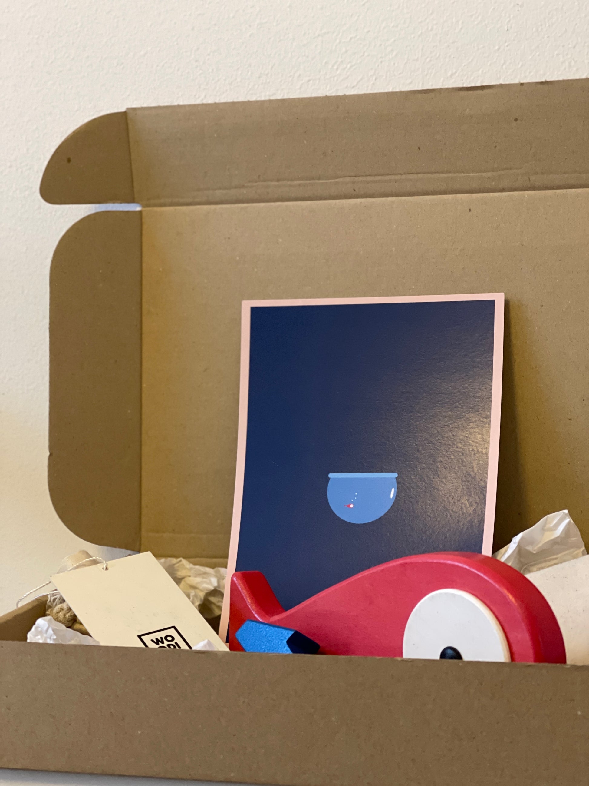 A lovely hand carved and hand painted art toy with a removable magnet tail. Blue stand that represents the ocean and when the fish is placed on the stand it feels like the fish is placed on the top of the water. Detail