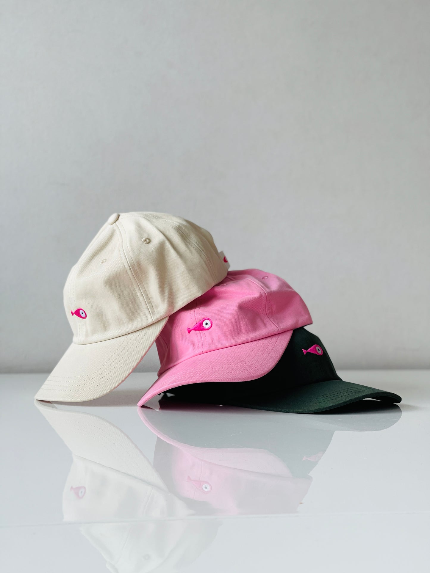 Cap Classic "Fish"  Slightly curved brim  Fish embroidery on front  Label on the back  Buckle to adjust the fit  5 Colors available : Navy Blue, Black, Pink, Olive Green and Light Beige  100 % cotton  One size 