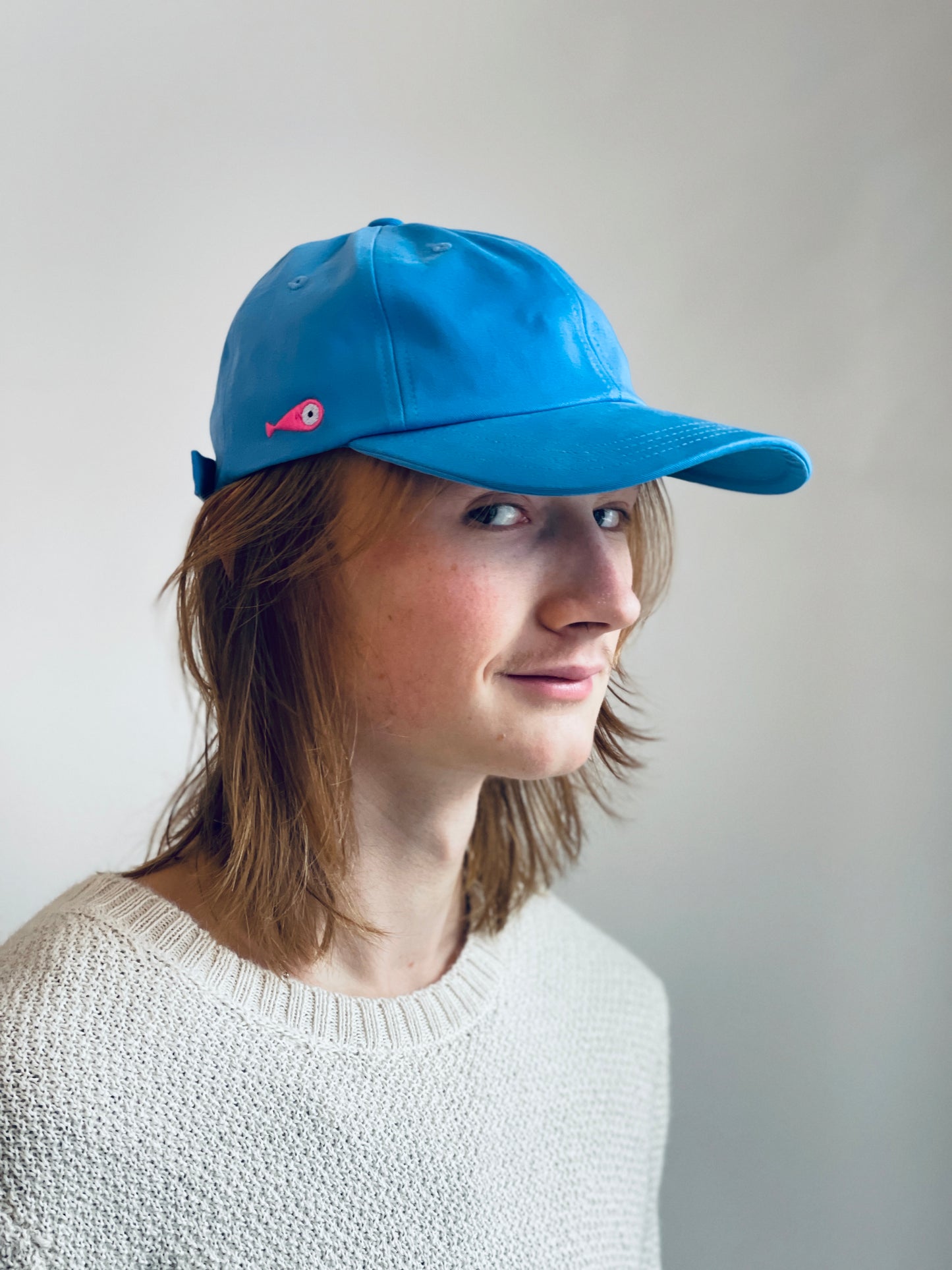 Cap Classic "Fish"  Slightly curved brim  Fish embroidery on the side  Label on the back  Buckle to adjust the fit  3 Colors available :   Light Blue  Grape Purple ( darker color than the sweet potato purple )  Sweet Potato Purple ( lighter color than the grape purple )  100 % cotton  One size