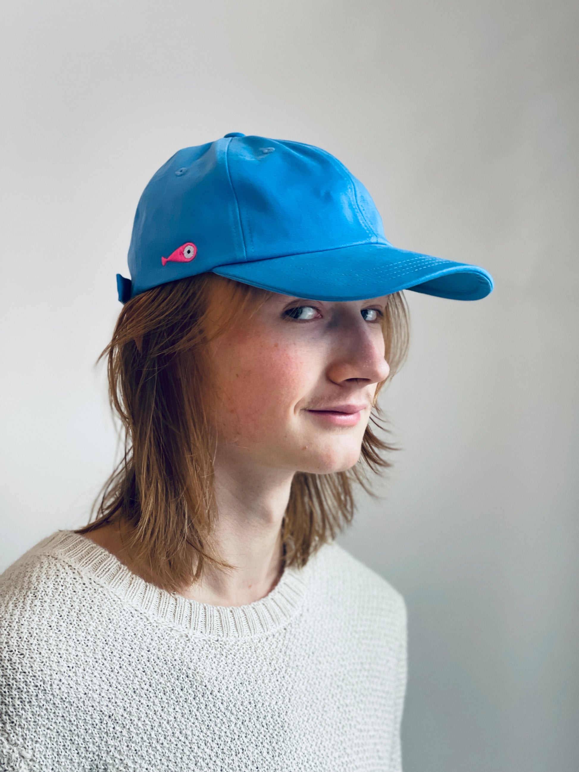 Cap Classic "Fish"  Slightly curved brim  Fish embroidery on the side  Label on the back  Buckle to adjust the fit  3 Colors available :   Light Blue  Grape Purple ( darker color than the sweet potato purple )  Sweet Potato Purple ( lighter color than the grape purple )  100 % cotton  One size