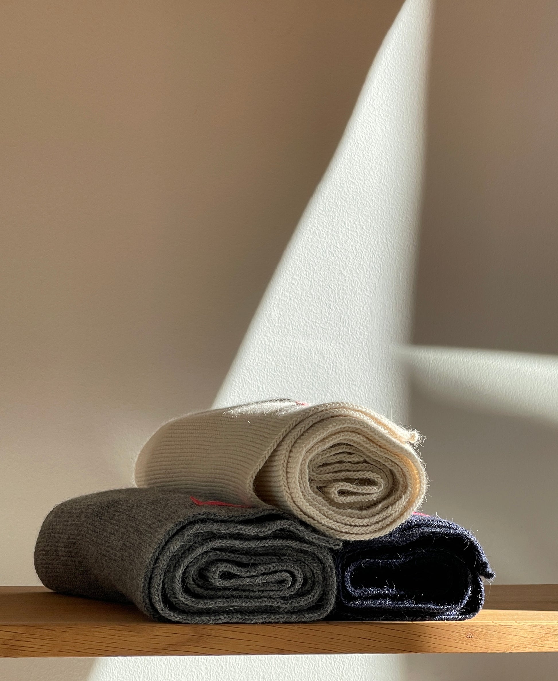 Soft, luxuriously and cozy scarfs. Knitted from a superfine alpaca yarn. Classic scarfs with a lovely feeling.  Colours : creme white, navy blue and grey  Material: 100% alpaca  Patch: pink fish  Sizes:  Navy Blue color : 2.20 cm x 22 cm  Grey color : 2.20 cm x 22 cm   Creme White color :  200 cm x 22 cm Front Smart casual dress code