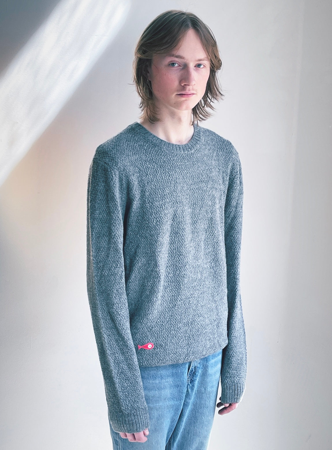 Soft, luxuriously cozy sweater. Knitted from fine alpaca yarn. Classic fit and a lovely feeling.  Colours : creme white, navy blue and grey  Patch: pink fish ( placed on the right bottom corner )  Material: 100% alpaca Front Smart casual dress code