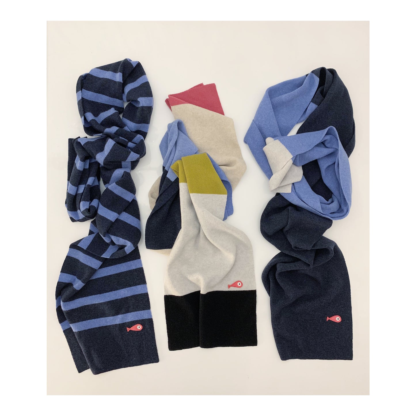 Soft, luxuriously and cozy scarfs. Knitted from a superfine lambswool yarn. Classic fit and a lovely feeling.  Colors available - blue striped, 8 colors and 3 colors  Size: 2.20 cm x 30 cm  100 % lambswool front