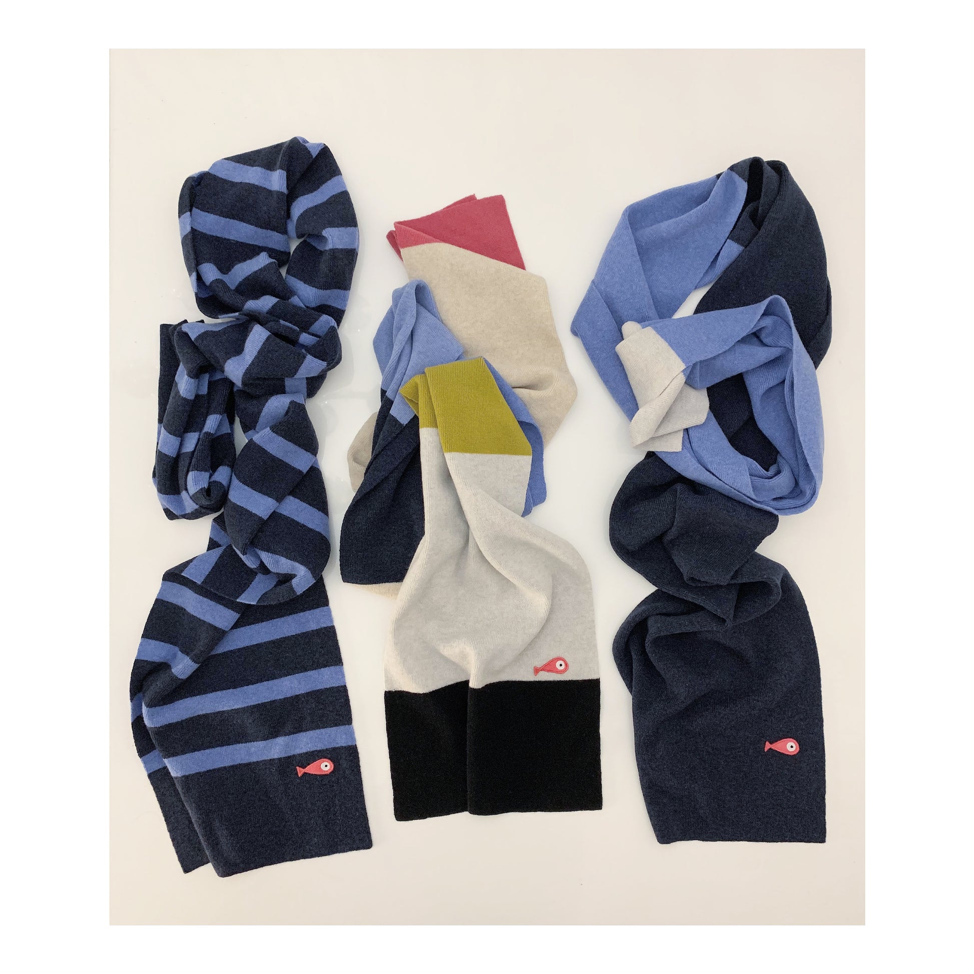 Soft, luxuriously and cozy scarfs. Knitted from a superfine lambswool yarn. Classic fit and a lovely feeling.  Colors available - blue striped, 8 colors and 3 colors  Size: 2.20 cm x 30 cm  100 % lambswool front