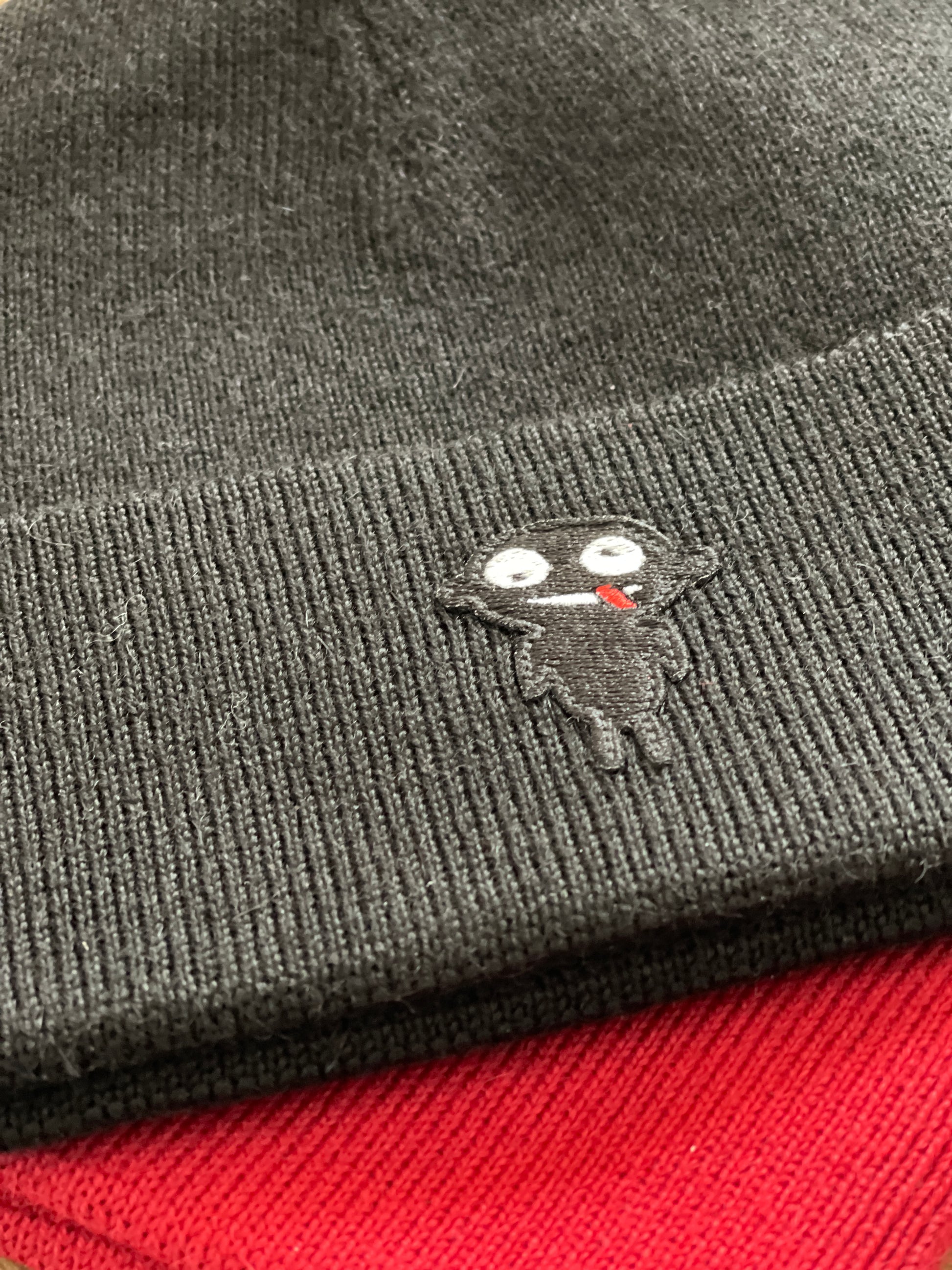 Beanie teddy is designed for both style and functionality. Crafted from luxurious alpaca yarn, these beanies offer an unparalleled level of warmth and comfort.  The tight-fitting design ensures a snug and cozy feel, while the high top provides extra coverage against chilly weather. The addition of a charming teddy patch adds a playful touch.  Available in Black and vibrant Red color, these beanies not only style but also the ultimate in comfort and quality. Detail