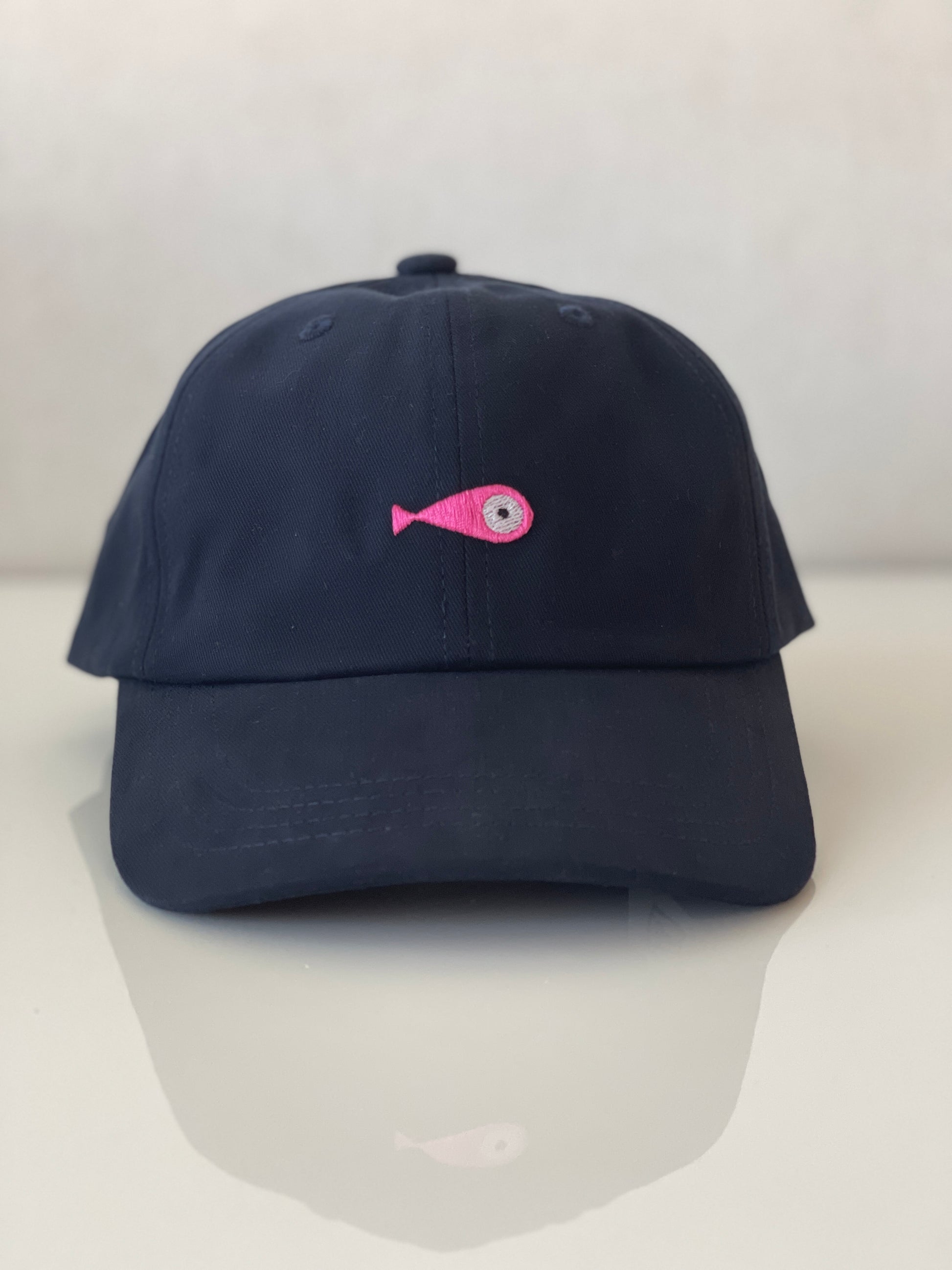 Cap Classic "Fish"  Slightly curved brim  Fish embroidery on front  Label on the back  Buckle to adjust the fit  5 Colors available : Navy Blue, Black, Pink, Olive Green and Light Beige  100 % cotton  One size Front