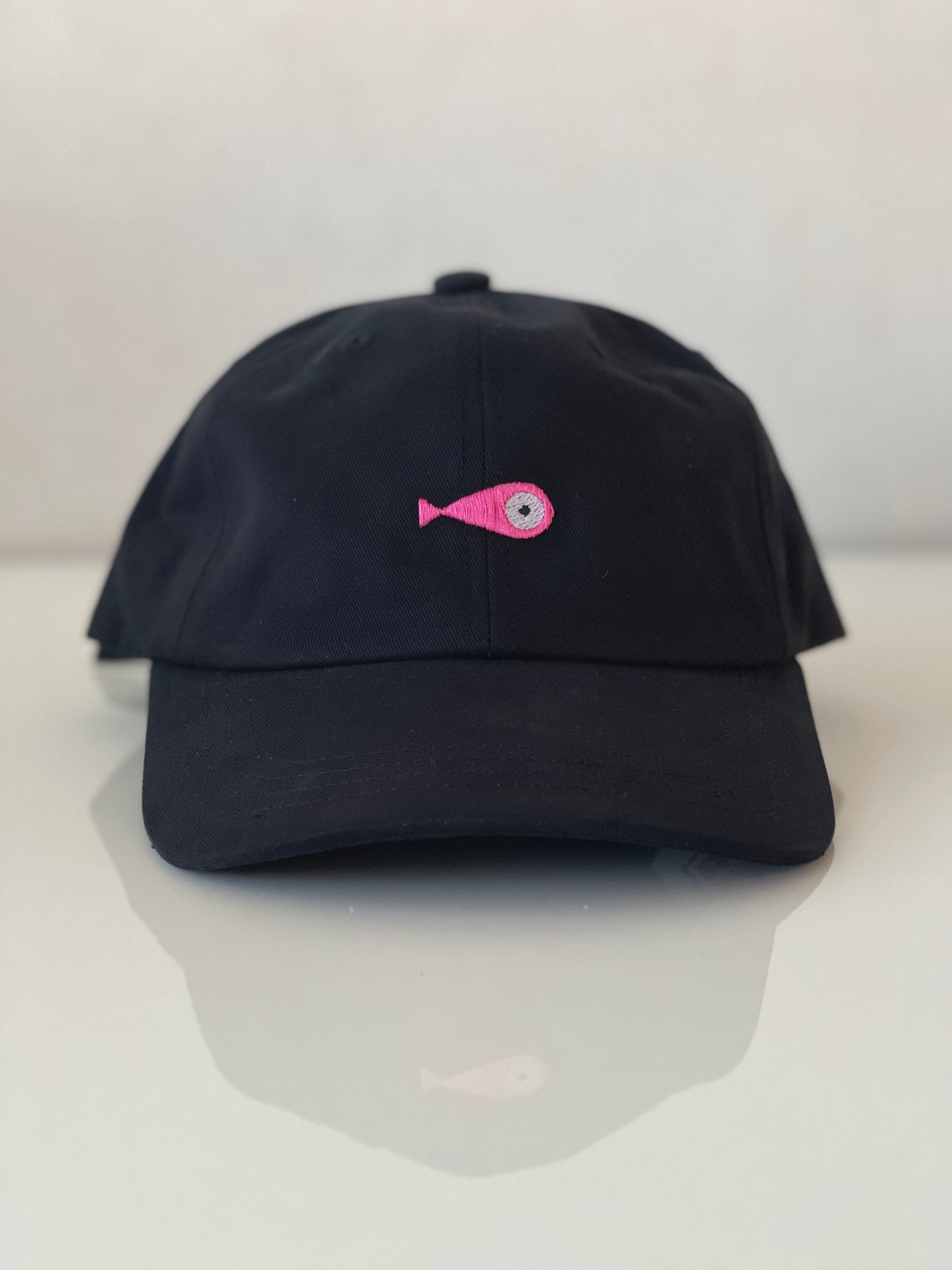 Cap Classic "Fish"  Slightly curved brim  Fish embroidery on front  Label on the back  Buckle to adjust the fit  5 Colors available : Navy Blue, Black, Pink, Olive Green and Light Beige  100 % cotton  One size Front