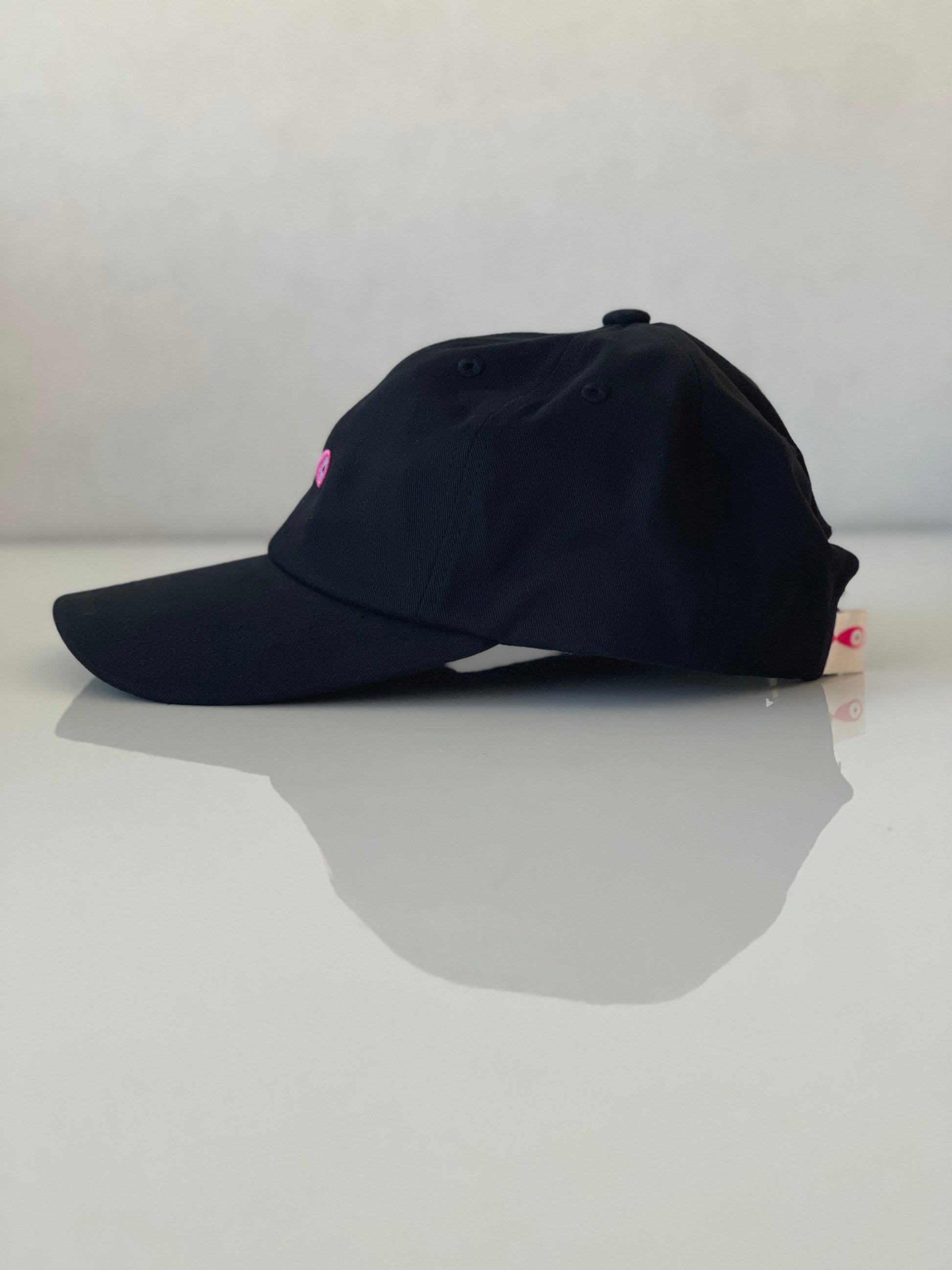 Cap Classic "Fish"  Slightly curved brim  Fish embroidery on front  Label on the back  Buckle to adjust the fit  5 Colors available : Navy Blue, Black, Pink, Olive Green and Light Beige  100 % cotton  One size Side Profile