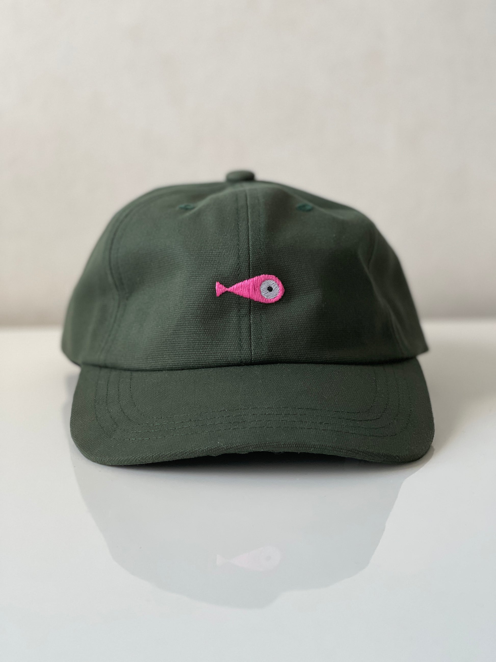 Cap Classic "Fish"  Slightly curved brim  Fish embroidery on front  Label on the back  Buckle to adjust the fit  5 Colors available : Navy Blue, Black, Pink, Olive Green and Light Beige  100 % cotton  One size  Front