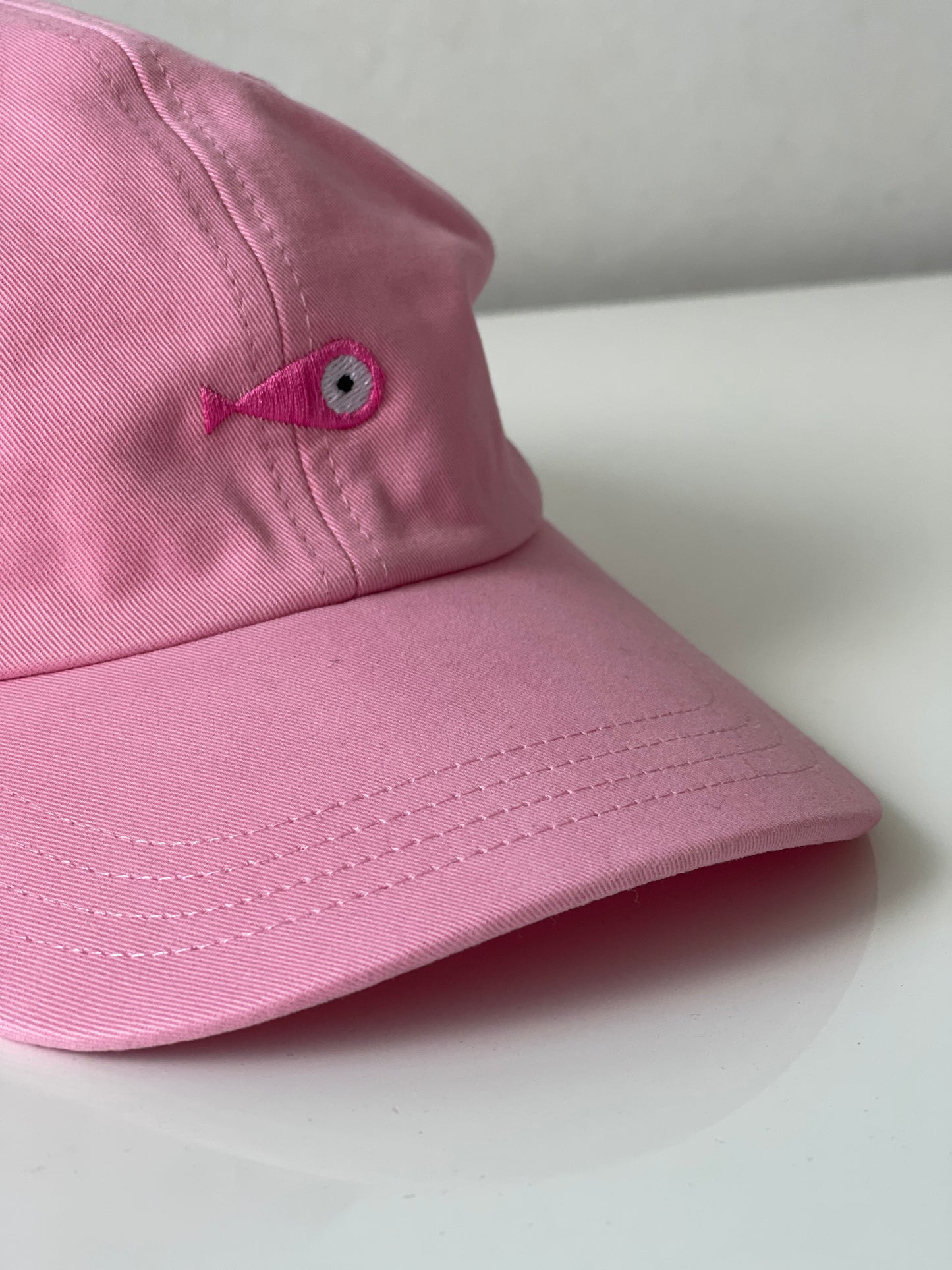 Cap Classic "Fish"  Slightly curved brim  Fish embroidery on front  Label on the back  Buckle to adjust the fit  5 Colors available : Navy Blue, Black, Pink, Olive Green and Light Beige  100 % cotton  One size  Front Side
