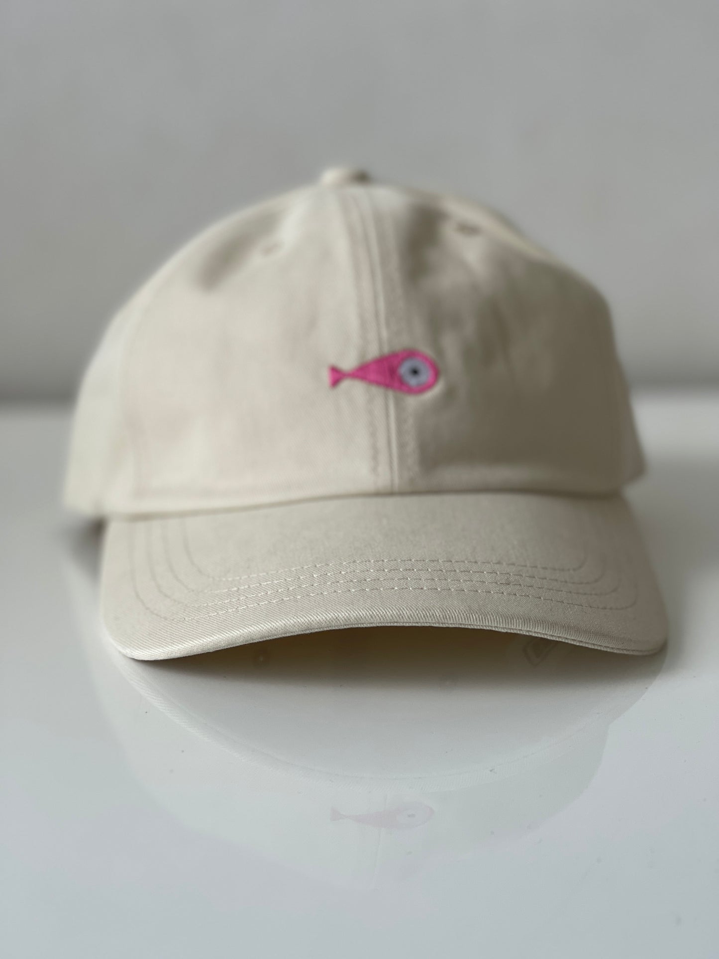 Cap Classic "Fish"  Slightly curved brim  Fish embroidery on front  Label on the back  Buckle to adjust the fit  5 Colors available : Navy Blue, Black, Pink, Olive Green and Light Beige  100 % cotton  One size 