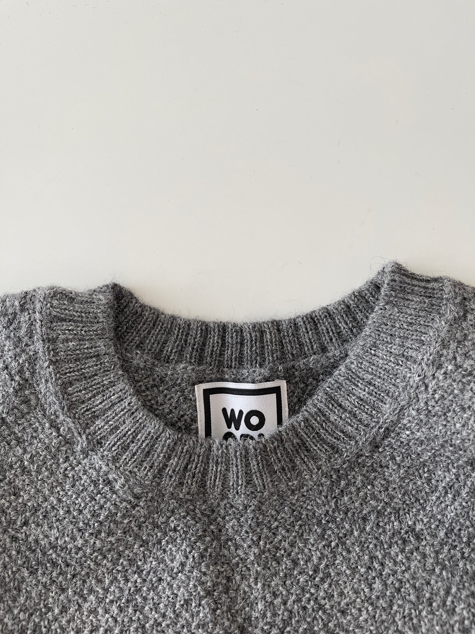 Soft, luxuriously cozy sweater. Knitted from fine alpaca yarn. Classic fit and a lovely feeling.  Colours : creme white, navy blue and grey  Patch: pink fish ( placed on the right bottom corner )  Material: 100% alpaca Detail smart casual dress code