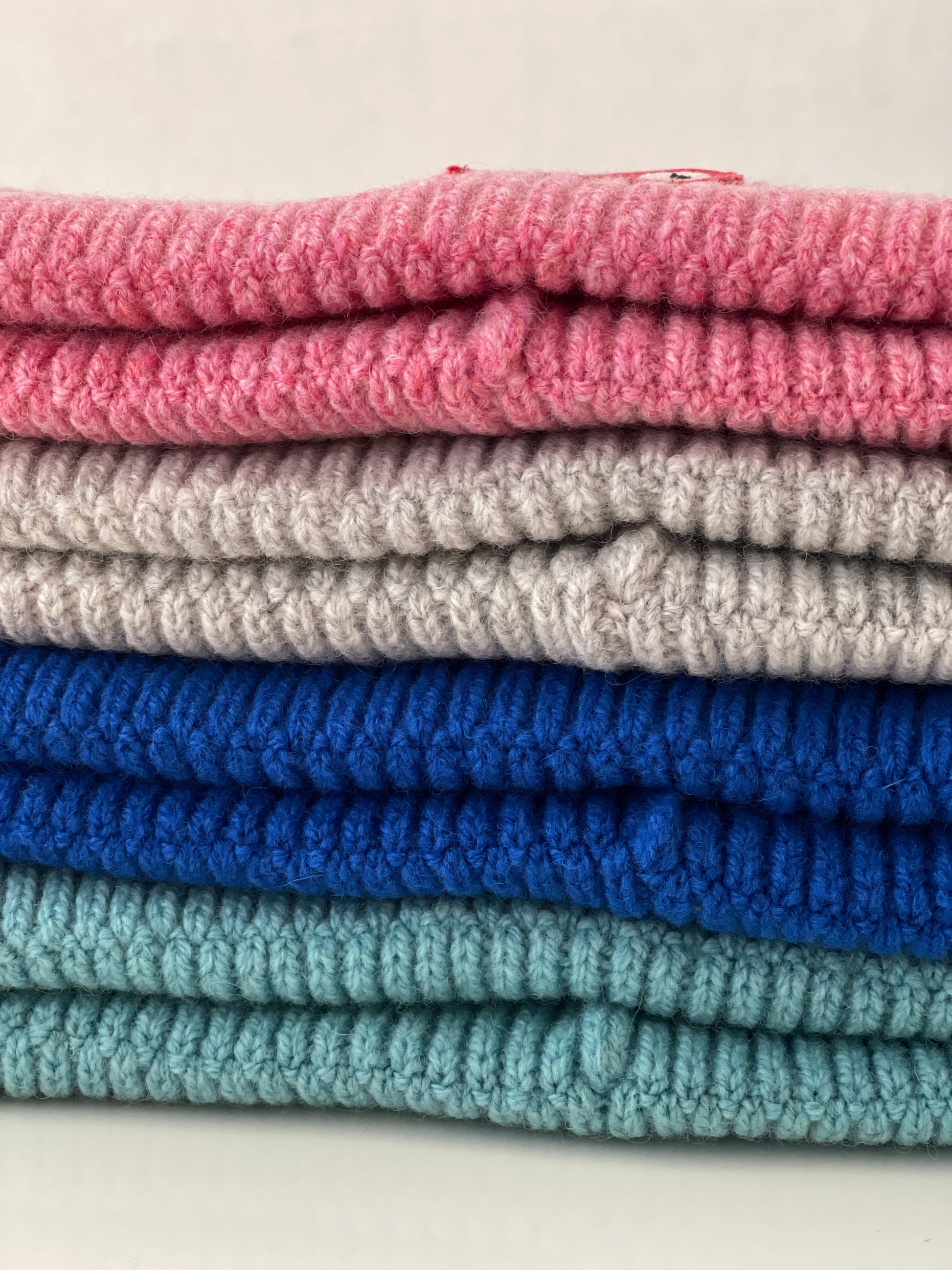 The collection of soft, colorful, and warm beanies crafted from luxurious lambswool yarn. Embrace comfort and style with these lovely accessories available in four captivating colors: Pink, Blue, Vibrant Mint, and Light Grey. Each beanie features a unique fish patch, adding a touch of charm and playfulness.  Detail